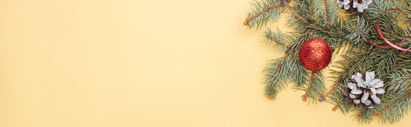 Top View Christmas Tree Branch Bauble Yellow Background Panoramic Shot — Stock Photo, Image
