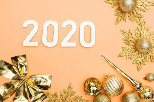 Top View White 2020 Numbers Golden Christmas Decoration Orange Background — Stock Photo, Image