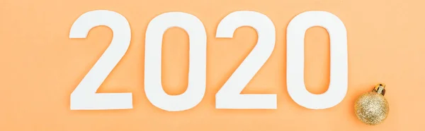 Top View White 2020 Numbers Golden Bauble Orange Background Panoramic — Stock Photo, Image