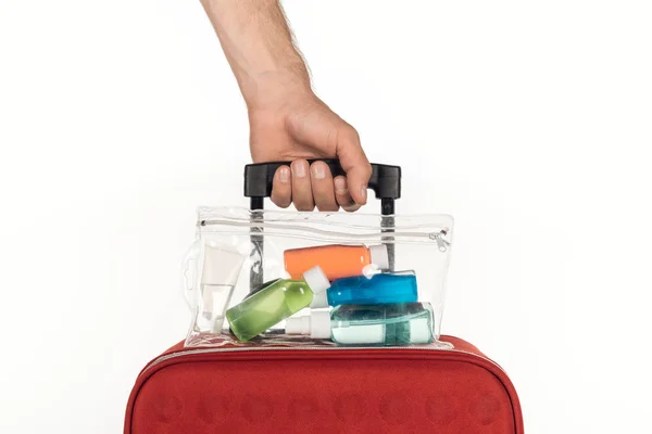 Cropped View Man Holding Travel Bag Cosmetic Bag Colorful Bottles — Stock Photo, Image