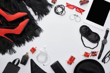 top view of dress, heels, gadget, gift boxes, sleeping mask, sunglasses, perfume, wristwatch, earrings, earphones, bracelets, bag, hat  clipart