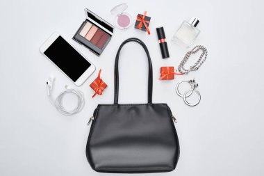 top view of gadget, gift boxes, bag, perfume, earrings, earphones, bracelets, decorative cosmetics clipart