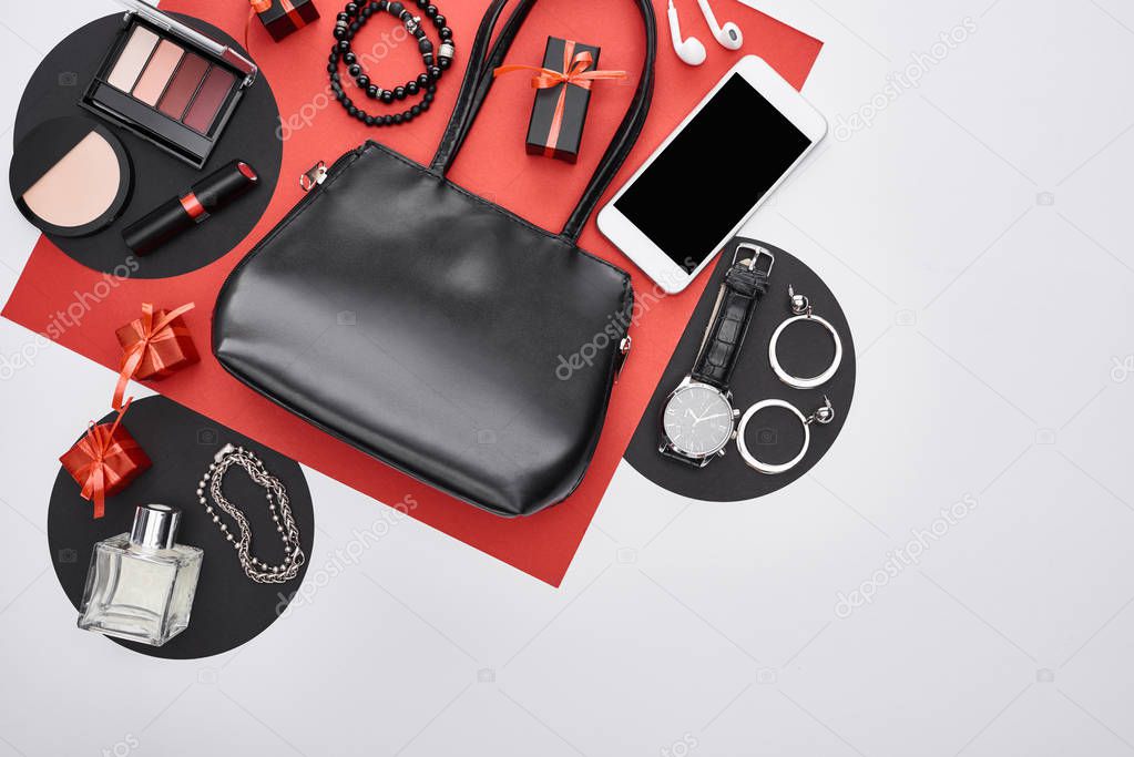 top view of gadget, gift boxes, perfume, bracelets, decorative cosmetics, earrings, bag, wristwatch