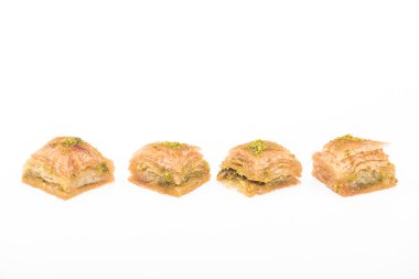 traditional turkish honey baklava with nuts in row isolated on white clipart