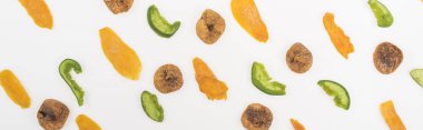 top view of assorted dried fruits and candied fruit isolated on white, panoramic shot