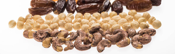 cashew, hazelnut and dates isolated on white, panoramic shot