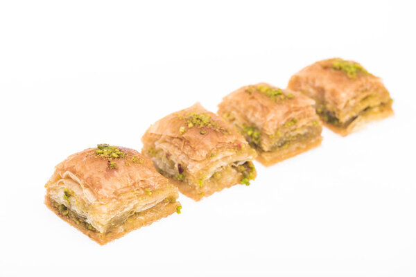 traditional turkish honey baklava with nuts isolated on white