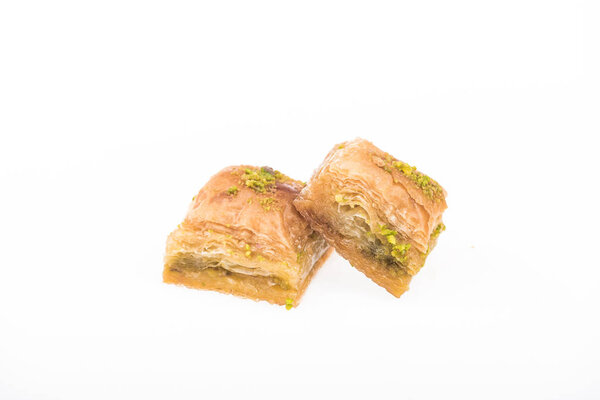 traditional turkish honey baklava with nuts isolated on white