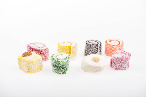 assorted delicious turkish delight in coconut flakes isolated on white