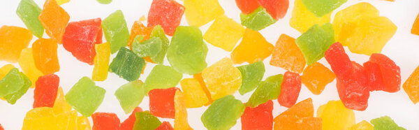 top view of colorful delicious candied fruit isolated on white, panoramic shot