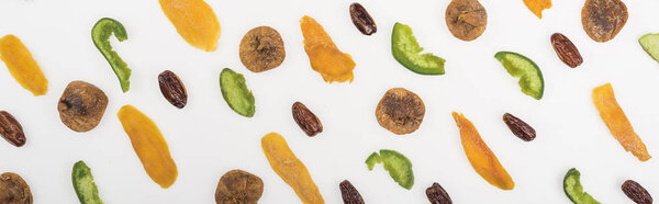 top view of assorted dried fruits and candied fruit isolated on white, panoramic shot