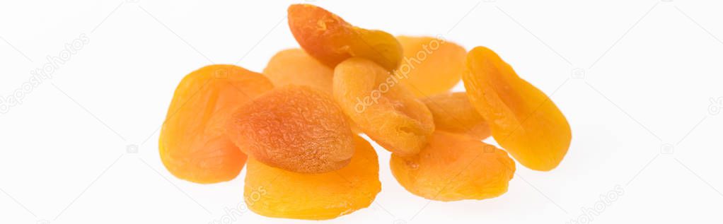 heap of delicious dried apricots isolated on white, panoramic shot