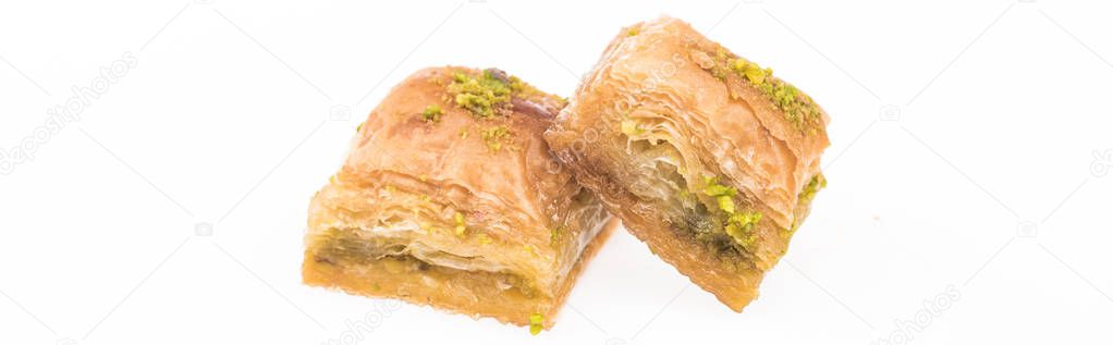 traditional turkish honey baklava with nuts isolated on white, panoramic shot