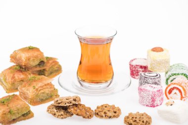 cup of tea near baklava, turkish delight and gozinaki isolated on white clipart