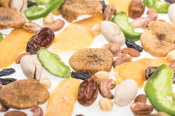 close up view of Turkish assorted nuts, dried fruits and candied fruit isolated on white
