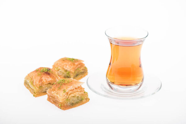 cup of tea near turkish baklava isolated on white