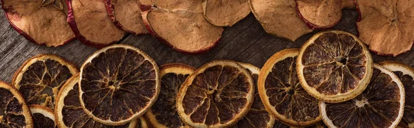 Panoramic Shot Dried Orange Apple Slices Wooden Background — Stock Photo, Image