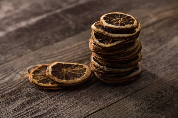 dried citrus slices on wooden brown surface