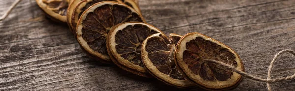 Dried Orange Slices Rope Wooden Surface Panoramic Shot — Stock Photo, Image