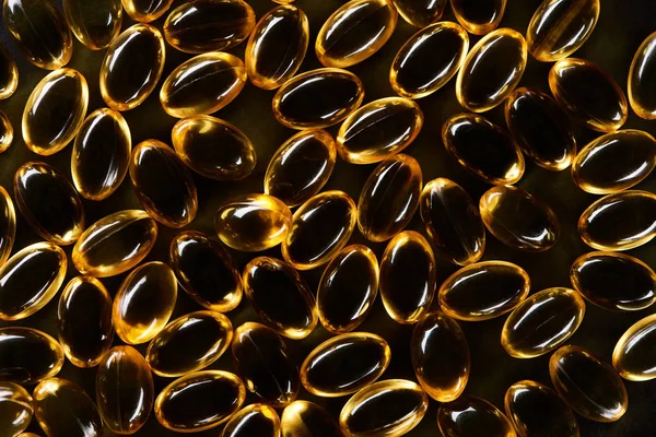 Top View Golden Fish Oil Capsules Black Background Dark — Stock Photo, Image