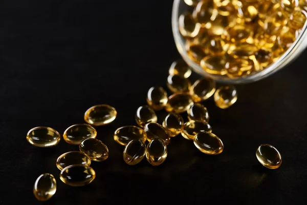 Selective Focus Golden Fish Oil Capsules Glass Bowl Isolated Black — Stock Photo, Image