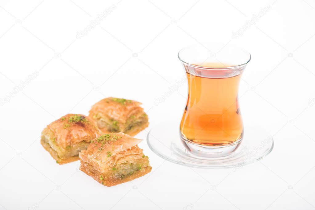cup of tea near turkish baklava isolated on white