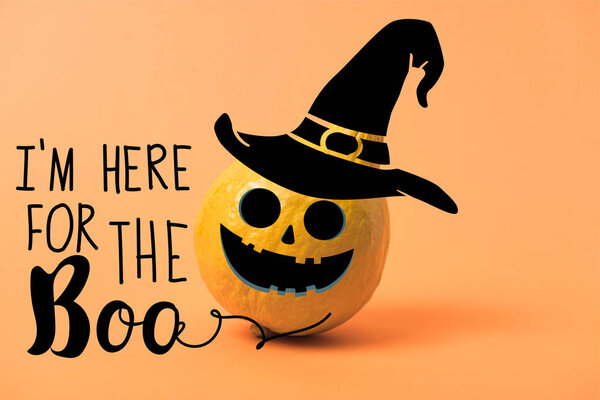 painted yellow Halloween pumpkin on orange colorful background with i am here for the boo illustration