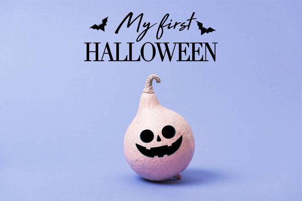 festive painted Halloween pumpkin on violet background with bats and my first Halloween illustration