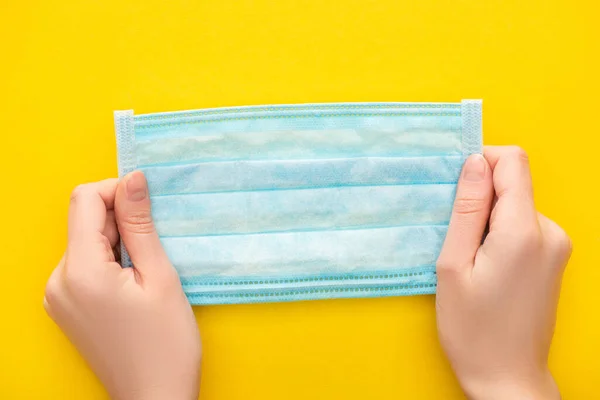 Partial View Woman Holding Medical Mask Yellow Background — Stock Photo, Image