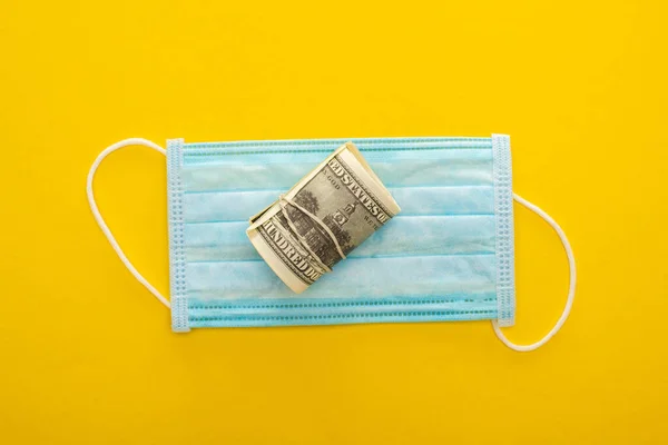 Top View Money Roll Medical Mask Yellow Background — Stok Foto