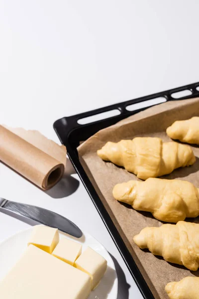 Selective Focus Raw Croissants Baking Tray Parchment Paper Butter Knife — Stock Photo, Image