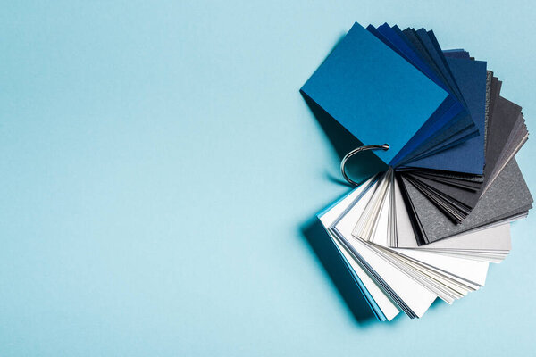 Top view of color samples on blue background