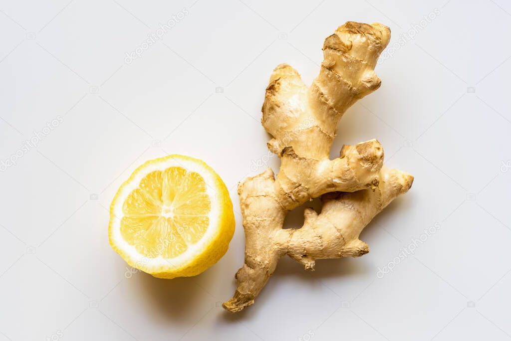 top view of ginger root, lemon on white background