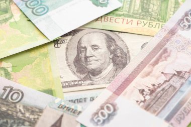 selective focus of russian rubles and dollar banknote  clipart