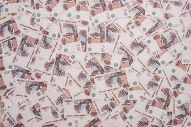 KYIV, UKRAINE - MARCH 25, 2020: top view of russian ruble banknotes  clipart