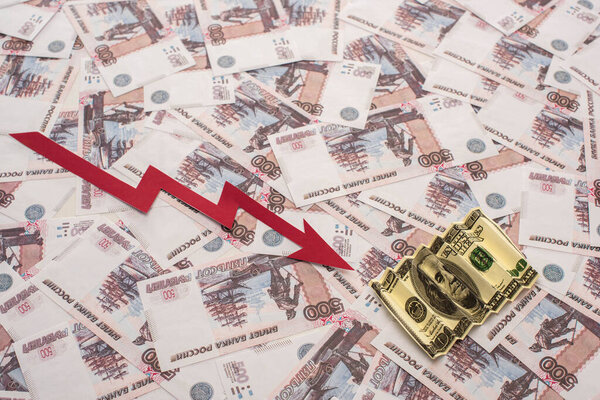 KYIV, UKRAINE - MARCH 25, 2020: top view of crisis graph near rubles and dollar banknote