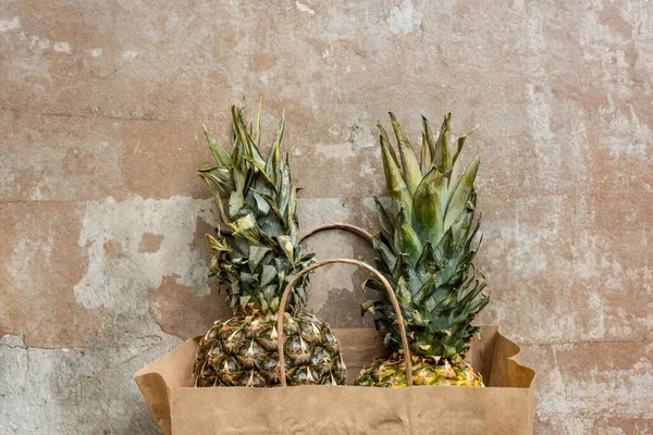 Top View Ripe Pineapples Paper Bag Weathered Surface — Stock Photo, Image