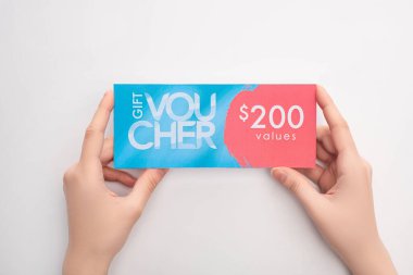 Top view of woman holding gift voucher with 200 values sign on white background clipart