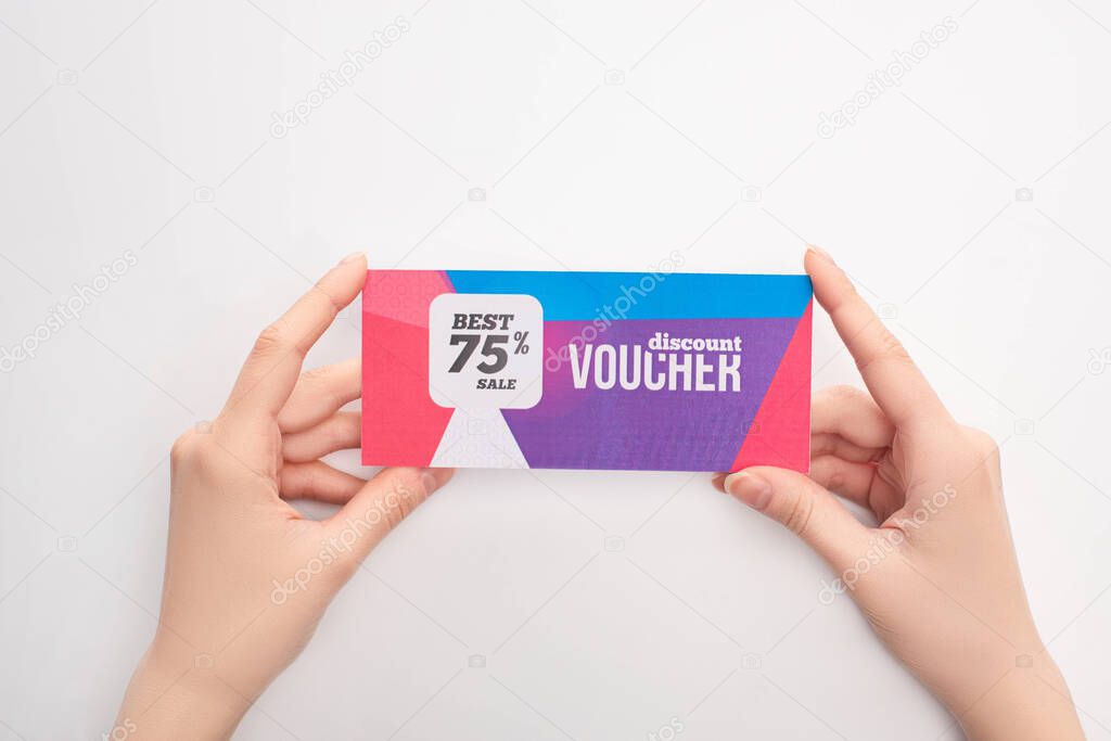 Cropped view of woman holding gift voucher with best sale lettering on white background