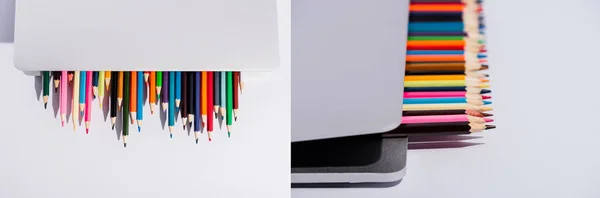 彩色铅笔在现代笔记本电脑上的拼贴 白色背景 全景拍摄 — 图库照片