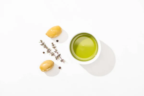 Top View Olive Oil Bowl Green Olives Herb Black Pepper — Stock Photo, Image