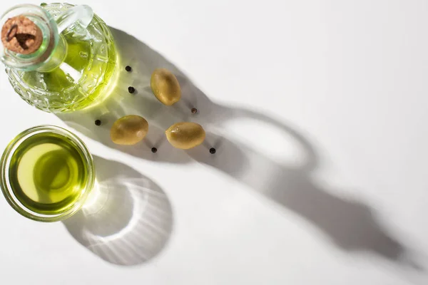 Top View Olive Oil Bottle Bowl Green Olives Black Pepper — Stock Photo, Image