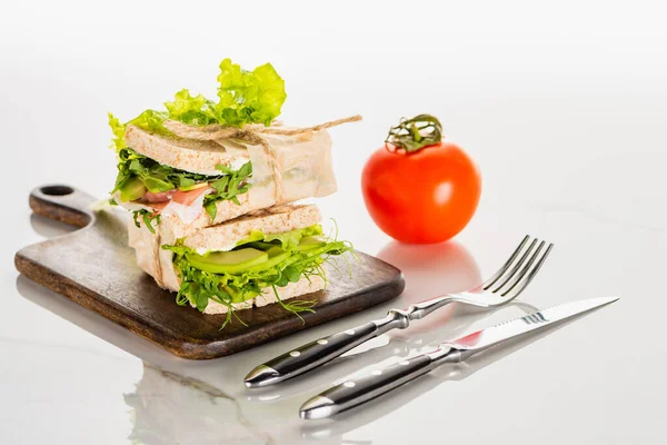 Fresh Green Sandwiches Wooden Cutting Board Cutlery Tomato White Marble — Stock Photo, Image