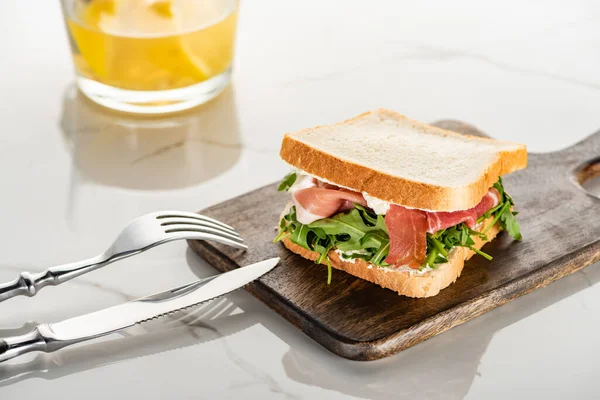 Fresh Green Sandwich Arugula Prosciutto Wooden Cutting Board Cutlery White — Stock Photo, Image