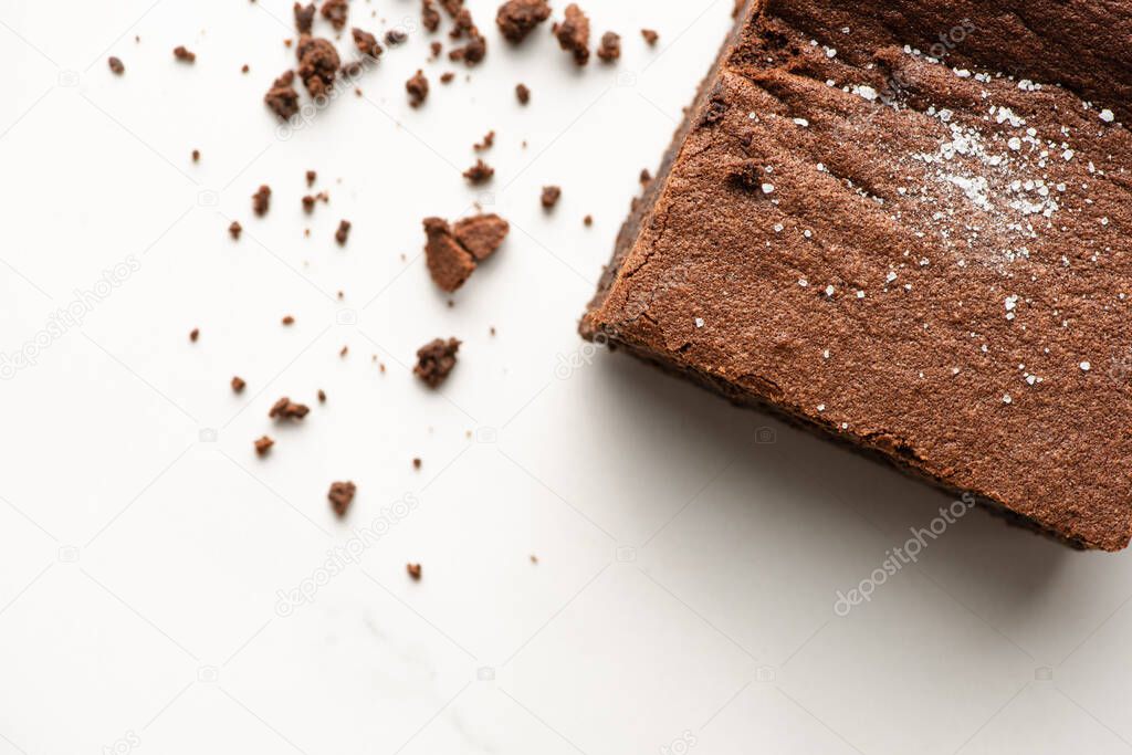top view of delicious brownie piece on white background