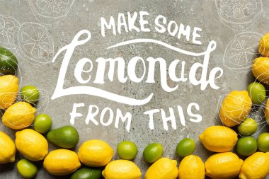 Gri beton yüzeyde renkli avokado, limon ve limon manzarası, bu resimden biraz limonata yap.