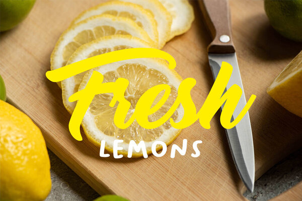 close up view of sliced lemon on wooden cutting board with knife, fresh lemons illustration