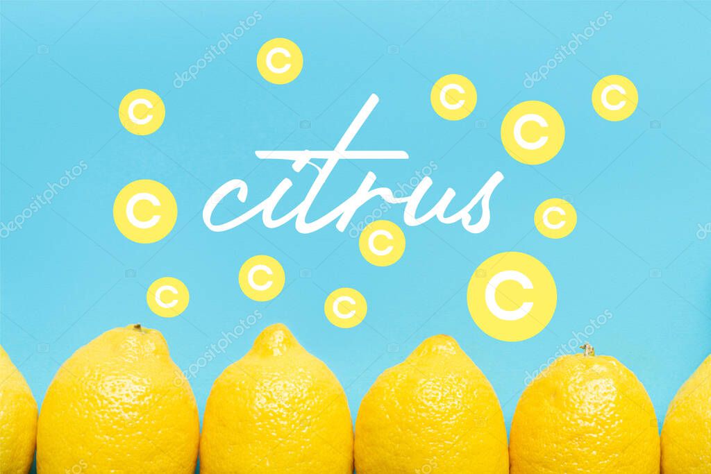 Top view of ripe yellow lemon on blue background with citrus filtration