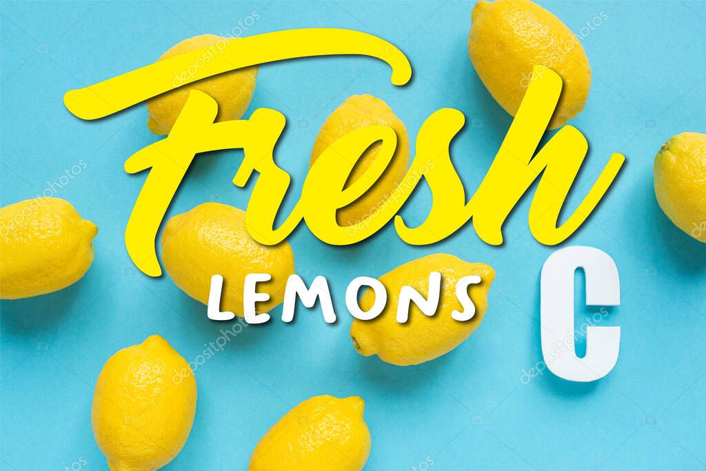 Top view of ripe yellow lemons and letter C on blue background, fresh lemons illustration