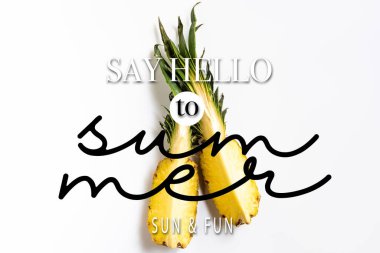 top view of cut ripe pineapple with green leaves on white background with say hello to summer illustration clipart